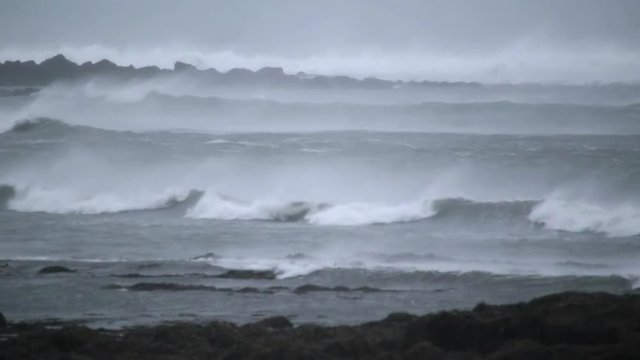 Heavy surf, breaking waves on reef gale force hurricane winds Iceland