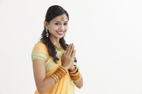 Indian woman in traditional clothing greeting