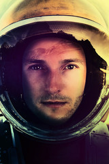 Space mission .Closeup portrait of an Astronaut in outer space 