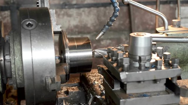 Old vintage lathe in the factory shop.