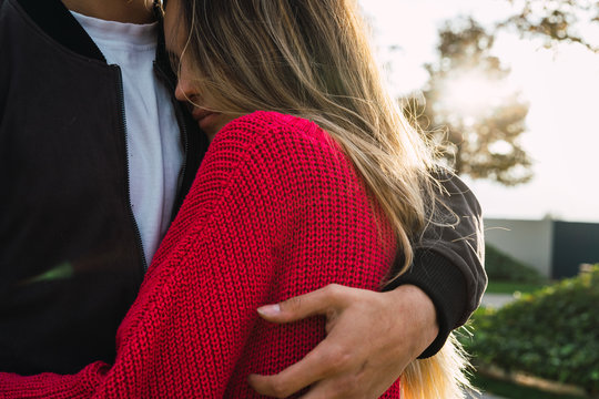 Couple embraced in a park