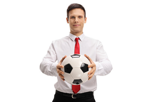 Formally dressed guy giving a football