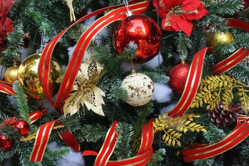 Colorful ornaments and ribbons on a Christmas tree