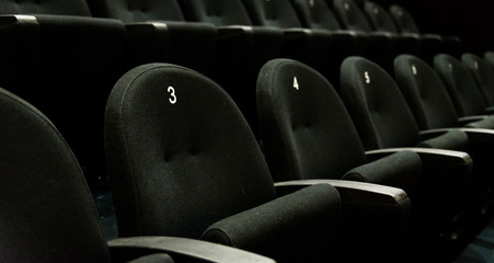Fototapeta premium Inside of auditorium movie theatre with seats and numbers.