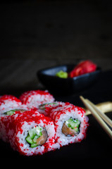 Sushi roll with salmon and cucumber.