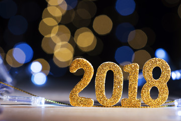 New year glittered number 2018, lights background