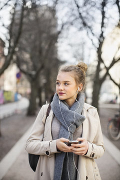 Teenage girl using cell phone