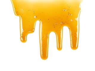 Honey dripping isolated on white background