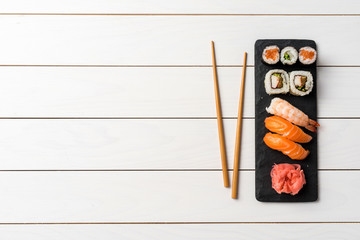 Set of Japanese sushi on white wooden table
