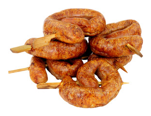 Group of savoury buffet mini party bratwurst sausage swirls isolated on a white background