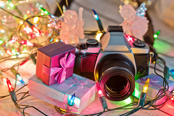 New Year gifts illuminated by garland