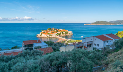Watching the sunrise at Saint Stephen (Sveti Stefan), Adriatic Sea, Balkan Peninsula, Montenegro, Europe