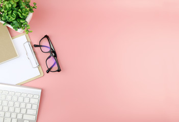 Office table with keyboard,glasses and Clipboard, copy space,Top view, flat lay