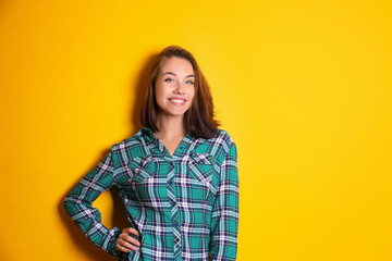 Beautiful smiling woman on color background