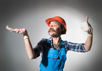 Funny worker advertises something on his hand.
