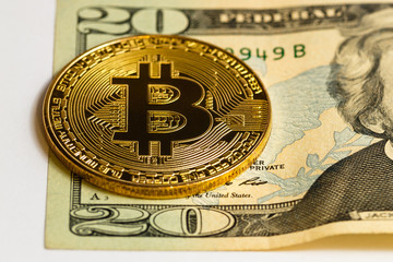 Golden bitcoin on us dollar bills electronic money exchange concept