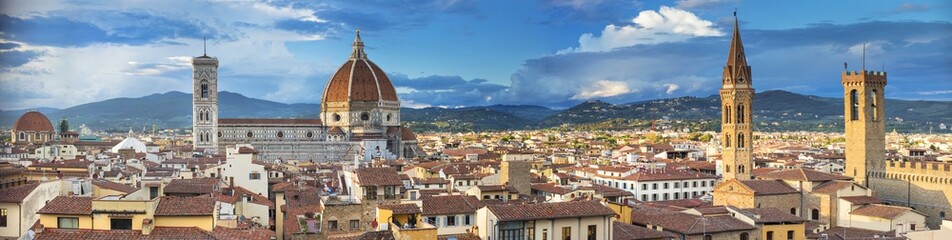 Fototapeta na wymiar Panoramic aerial view to Florence with towers and church in spring day in Italy