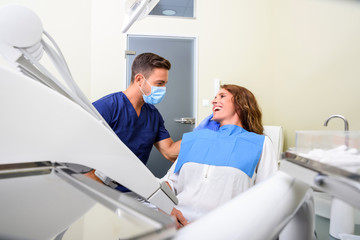 A Dentist attending a female Patient 