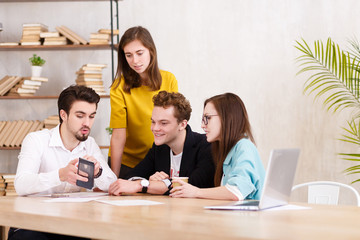 Team of young professionals works together