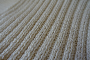 Close up of beige handmade rib knit fabric