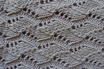 Close up of handmade knitted grey openwork