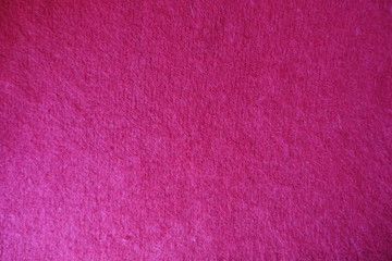 Handmade crimsom plain stockinette fabric from above
