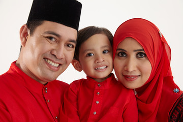 family in red baju raya
