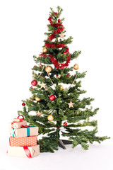 Fototapeta na wymiar Decorated Christmas tree with heap of gift boxes near it on white background