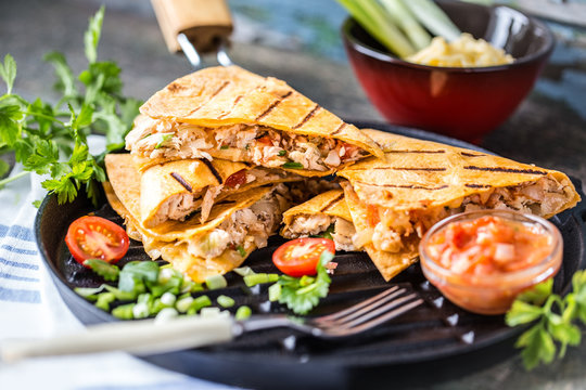 Mexican Food Quesadilla With Grilled Chicken, Salsa And Cheese, With Greens And Vegetables