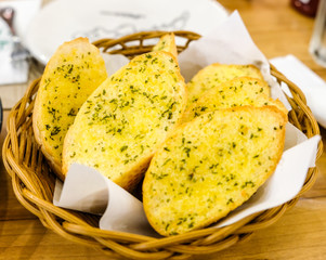 Garlic bread in the wooden basket