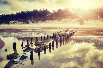 Color toned picture of an empty beach at sunset