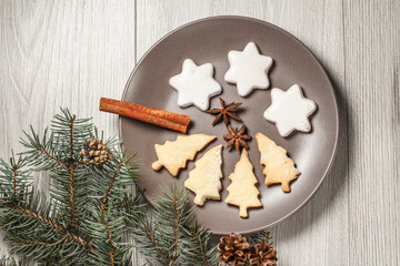 Gingerbread cookies in Christmas tree and star shape on plate