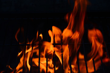 Black background with flames (red-hot grill)