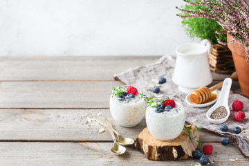 Healthy vegan white chia pudding with berries and green thyme