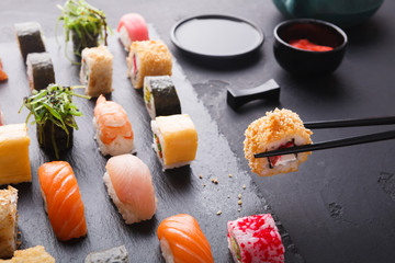 Eating sushi at restaurant, japanese cuisine