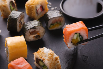 Eating sushi at restaurant, japanese cuisine