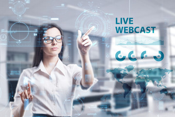 The concept of business, technology, the Internet and the network. A young entrepreneur working on a virtual screen of the future and sees the inscription: Live webcast
