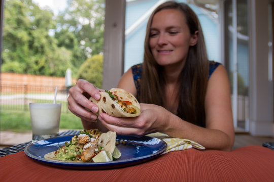 Woman Picks Up Fajita