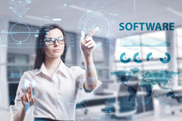 The concept of business, technology, the Internet and the network. A young entrepreneur working on a virtual screen of the future and sees the inscription: Software
