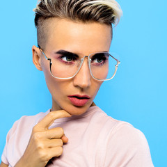 Tomboy Fashion Model in stylish accessories glasses. Trends eyewear