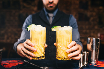 close up portrait of bartender or barman serving fresh drinks