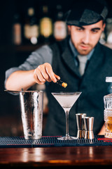 Martini, classic cocktail with olives, vodka and gin served cold in restaurant, pub or bar