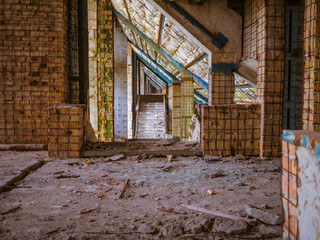 The old abandoned brick building. Steps.