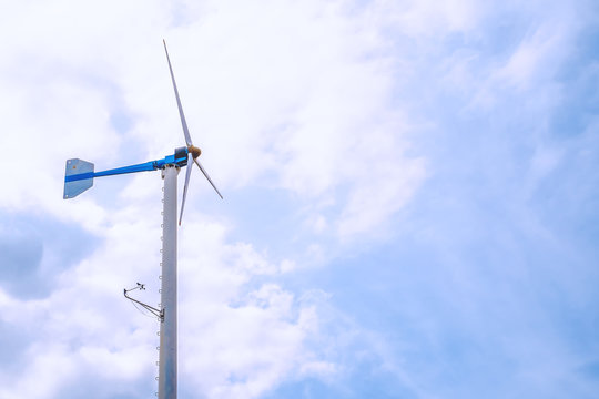 Wind turbines to produce electricity for renewable energy against clearly blue sky background