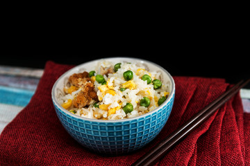Homemade Chinese fried rice with vegetables and fried eggs