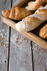 Bread bakery background. French baguettes and croissants composition