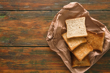 White bread toasts on rustic wood background