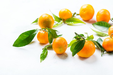 Organic healthy tangerine mandarine wreath on a table