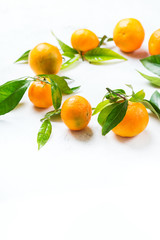 Organic healthy tangerine mandarine wreath on a table