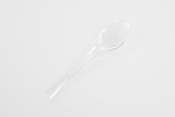 Plastic silverware spoon in white background